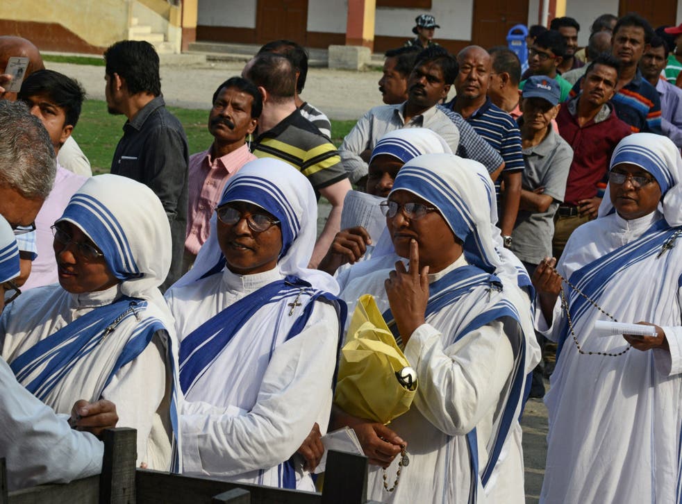 Indian voters queue up to cast their vote at a polling station in Siliguri, West Bengal