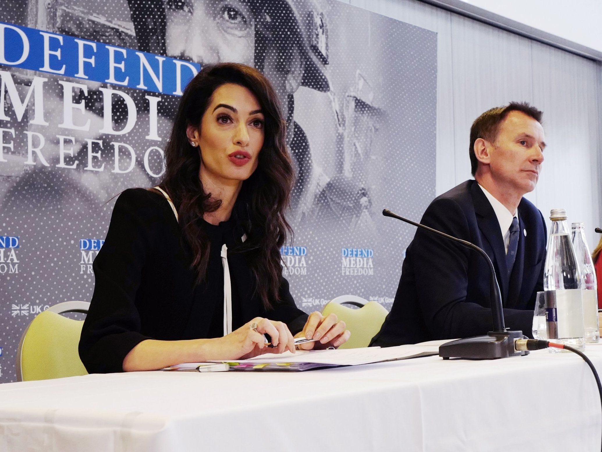 Barrister Amal Clooney with foreign secretary Jeremy Hunt at media freedom event on 5 April
