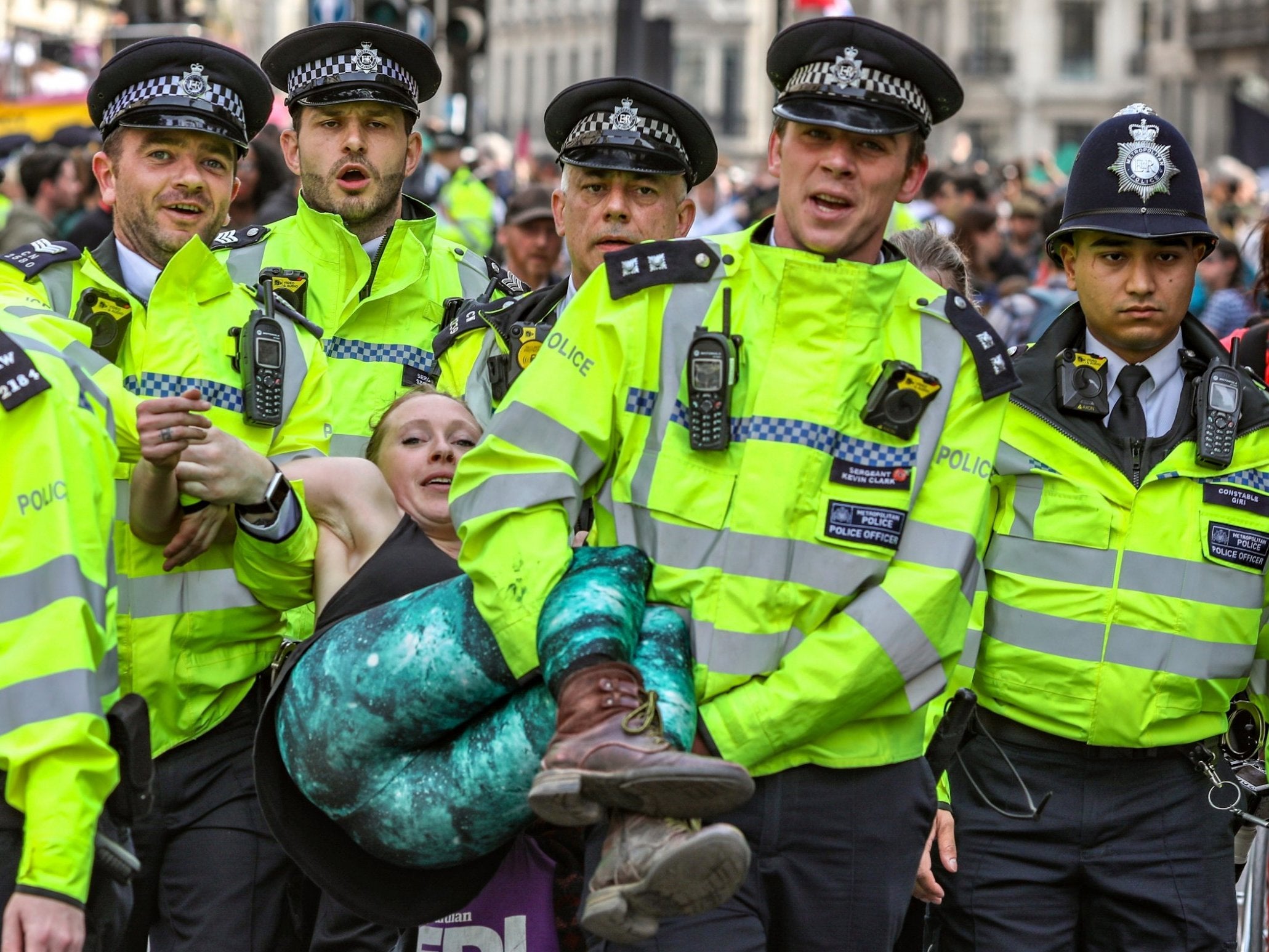 Police arrest protesters as they block traffic at Oxford Circus