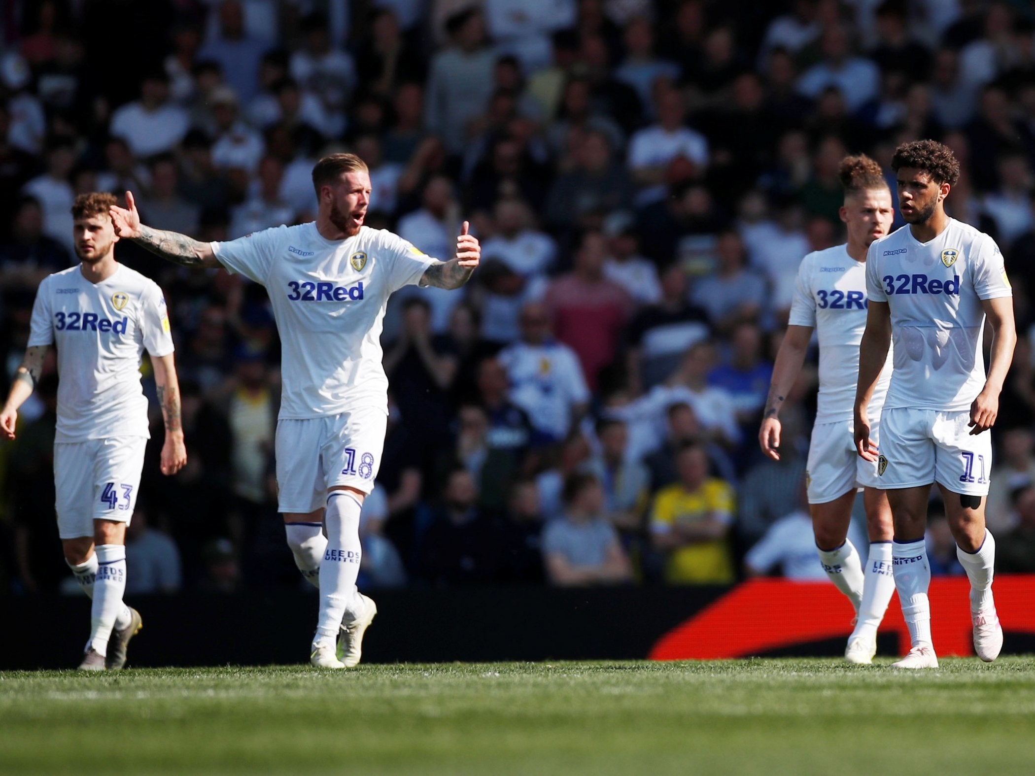 Leeds’ players react after Wigan’s equaliser before the break