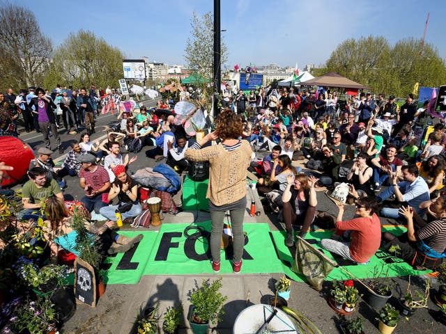 Extinction Rebellion demonstrators hold a community meeting on Waterloo Bridge