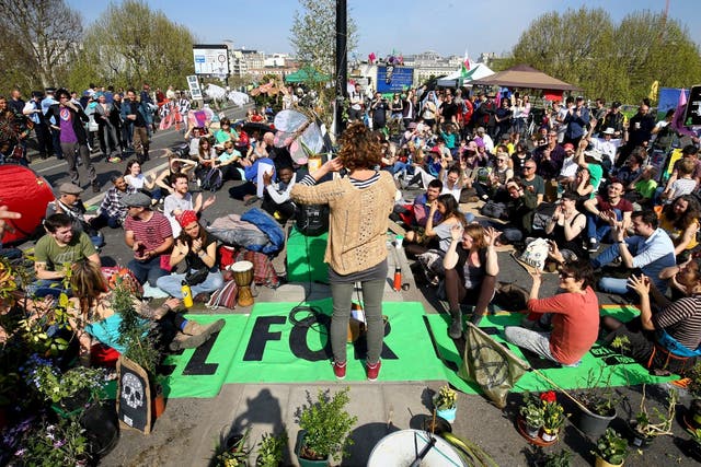 Extinction Rebellion demonstrators hold a community meeting on Waterloo Bridge