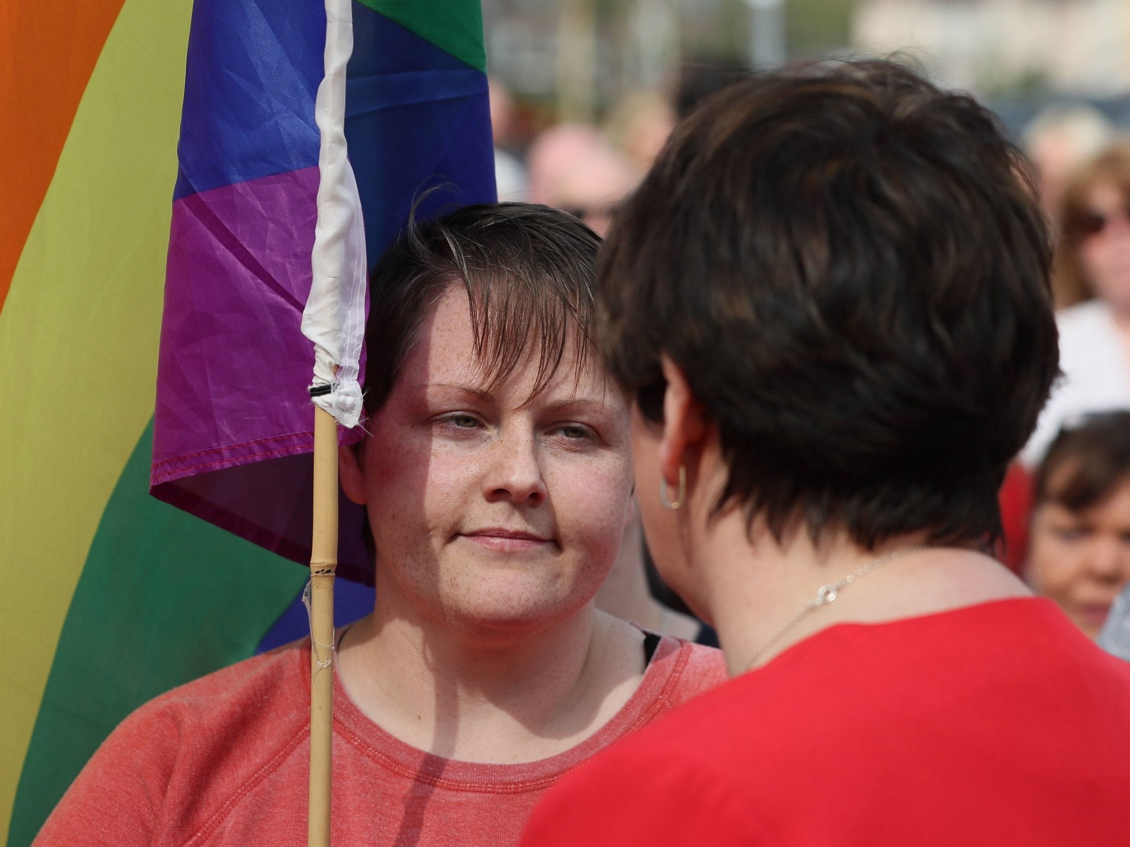 DUP leader Arlene Foster speaks with Sara Canning (left), the partner of journalist Lyra McKee, at a vigil