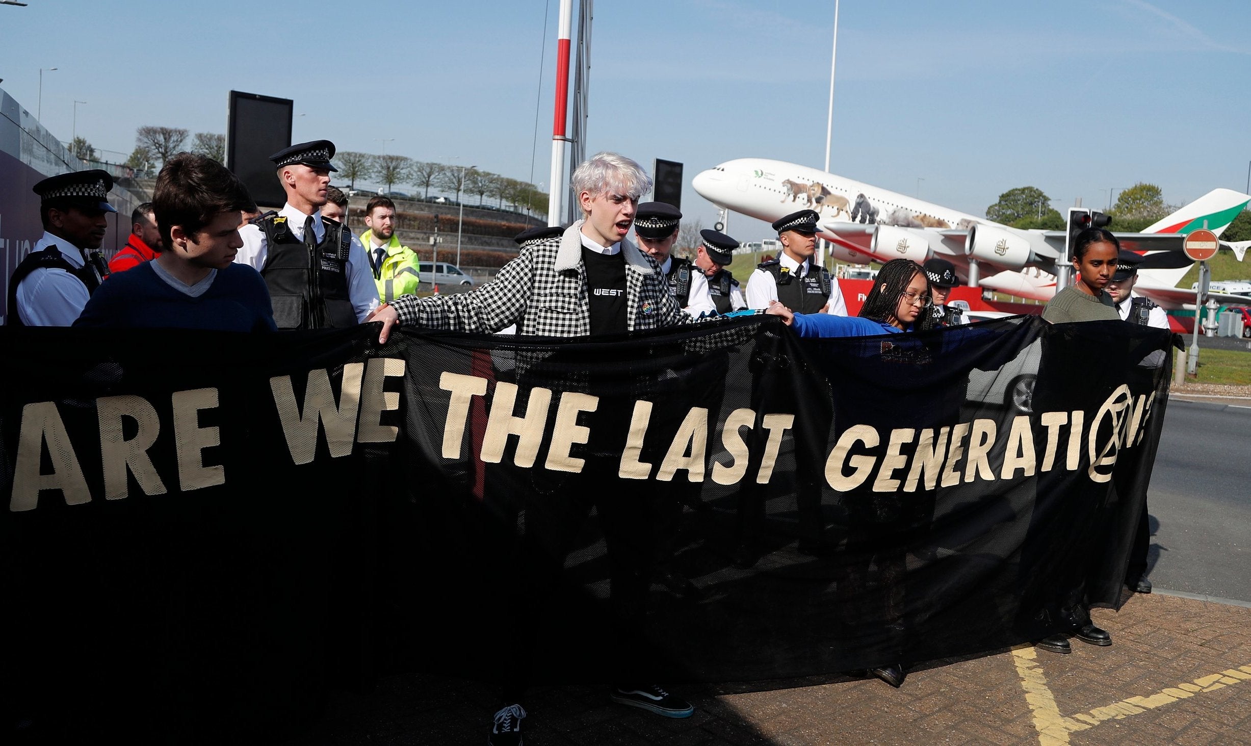 Police surround environmental protesters near Heathrow yesterday