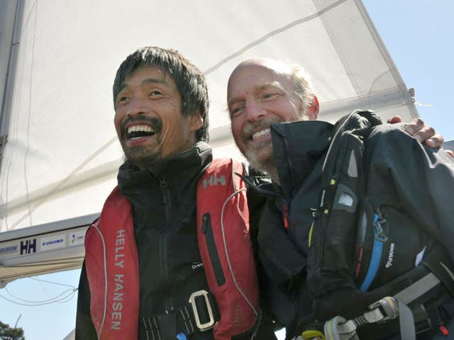 Two-month voyage: Mitsuhiro Iwamoto celebrates with his navigator Doug Smith yesterday after sailing the Pacific