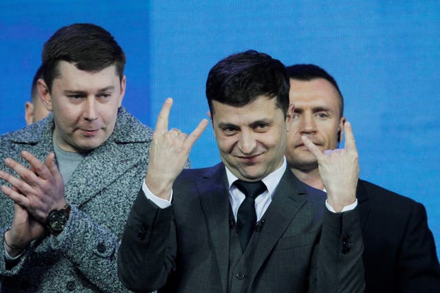 Volodymyr Zelensky (centre) gestures during a debate with Ukrainian president Petro Poroshenko