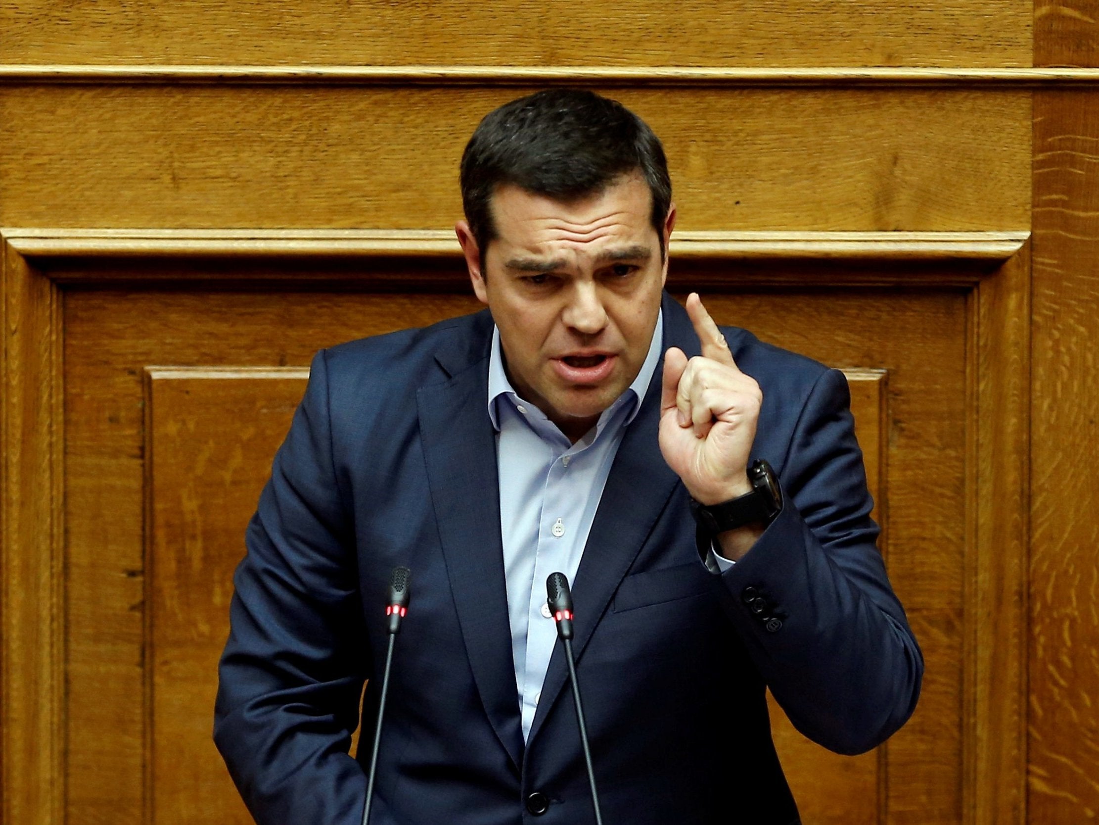 Alexis Tsipras addresses lawmakers before a vote on reparations