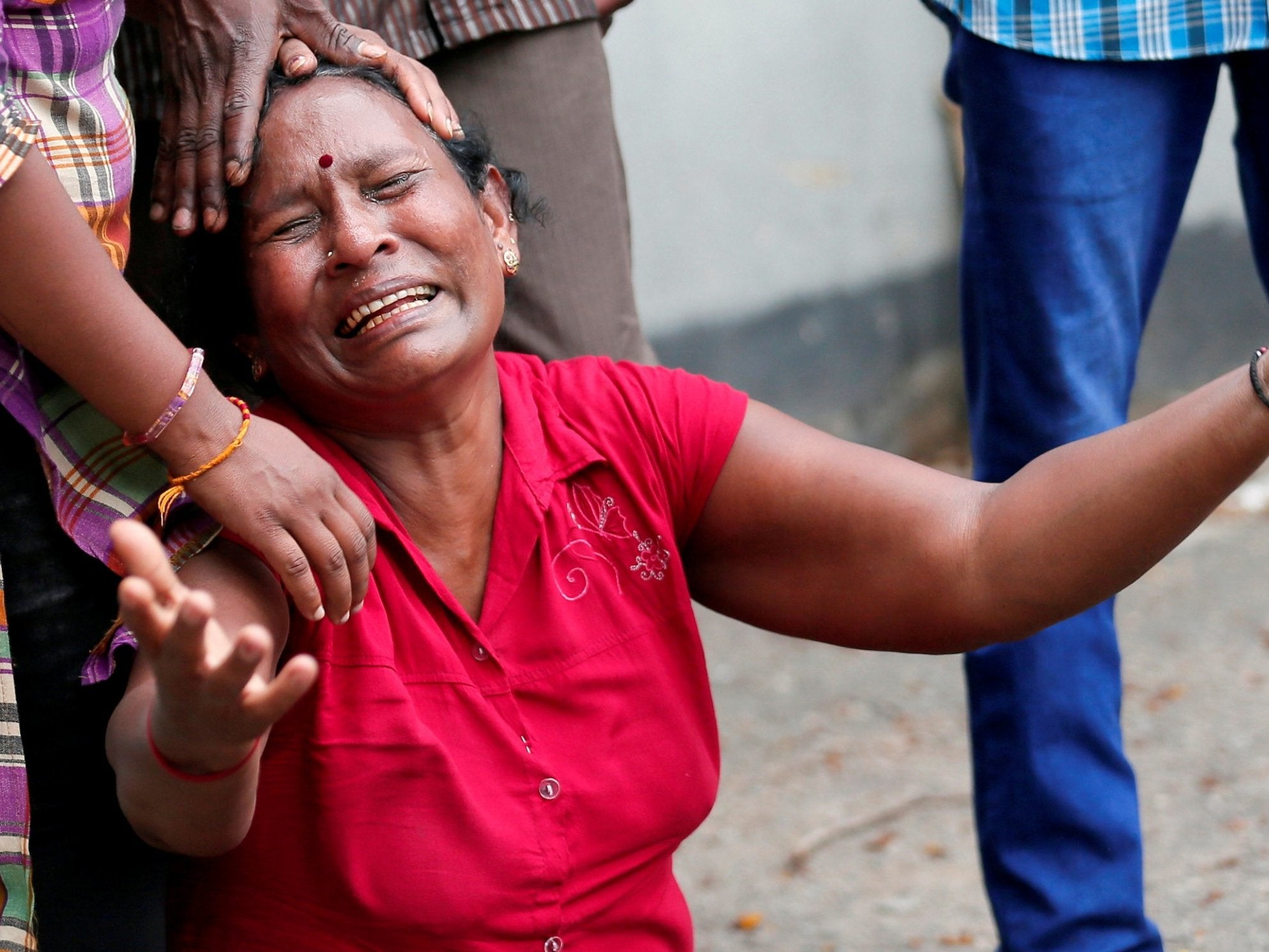 A relative of a victim of the explosion at St Anthony's Shrine, Kochchikade church, reacts at the police mortuary in Colombo, Sri Lanka, on 21 April 2019.