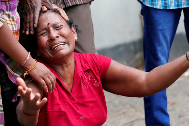 A relative of a victim of the explosion at St Anthony's Shrine, Kochchikade church, reacts at the police mortuary in Colombo, Sri Lanka, on 21 April 2019.