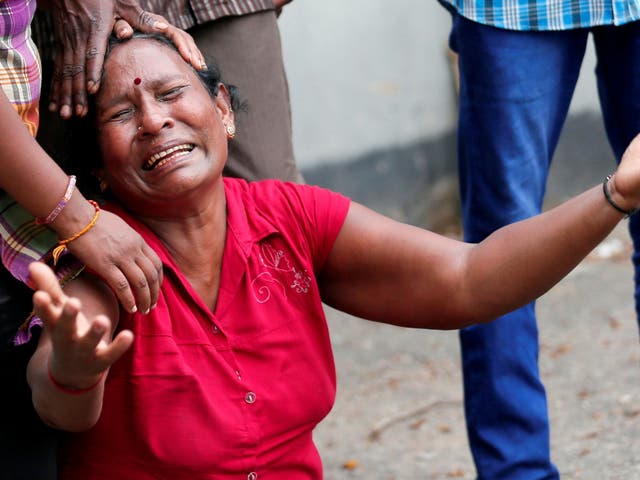 A relative of a victim of the explosion at St. Anthony's Shrine, Kochchikade church, reacts at the police mortuary in Colombo, Sri Lanka