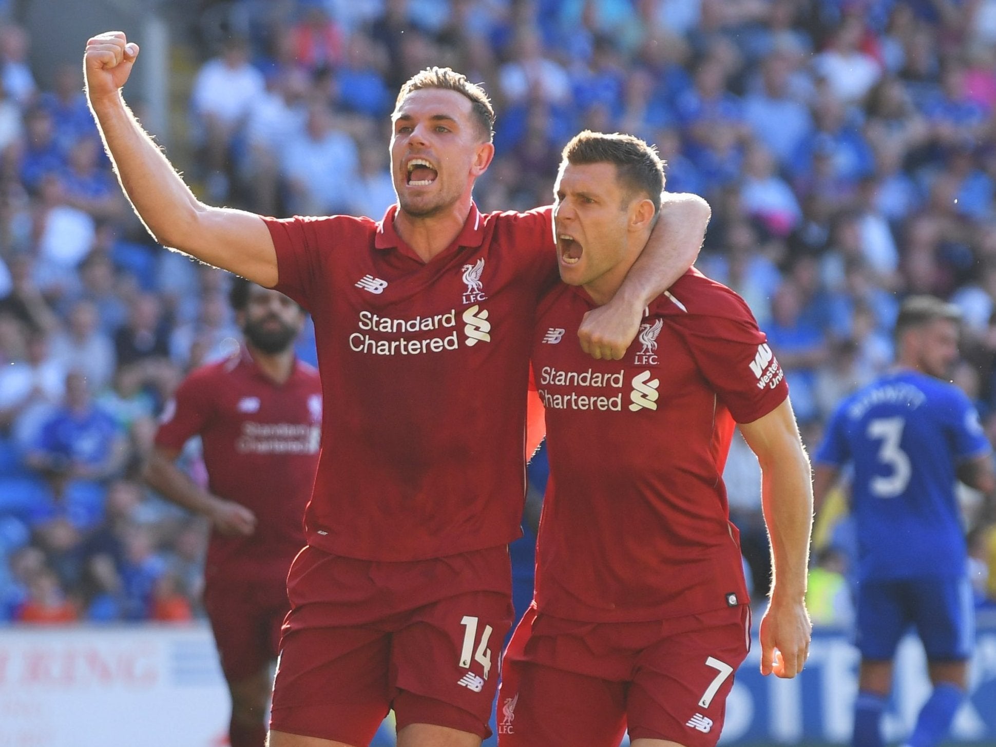 Jordan Henderson celebrates with James Milner after he scored Liverpool's second from the penalty spot