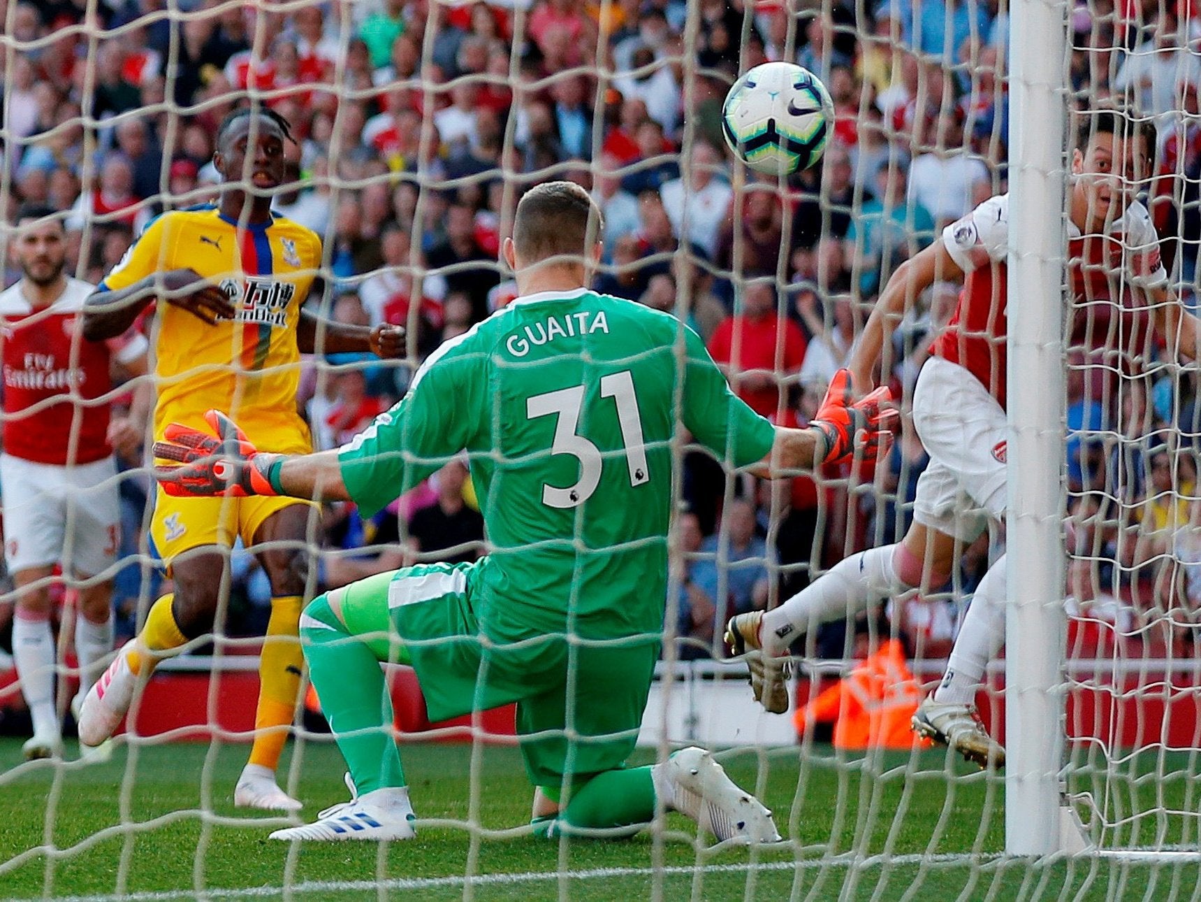 Ozil dinked the ball over the head of Guaita to draw Arsenal level