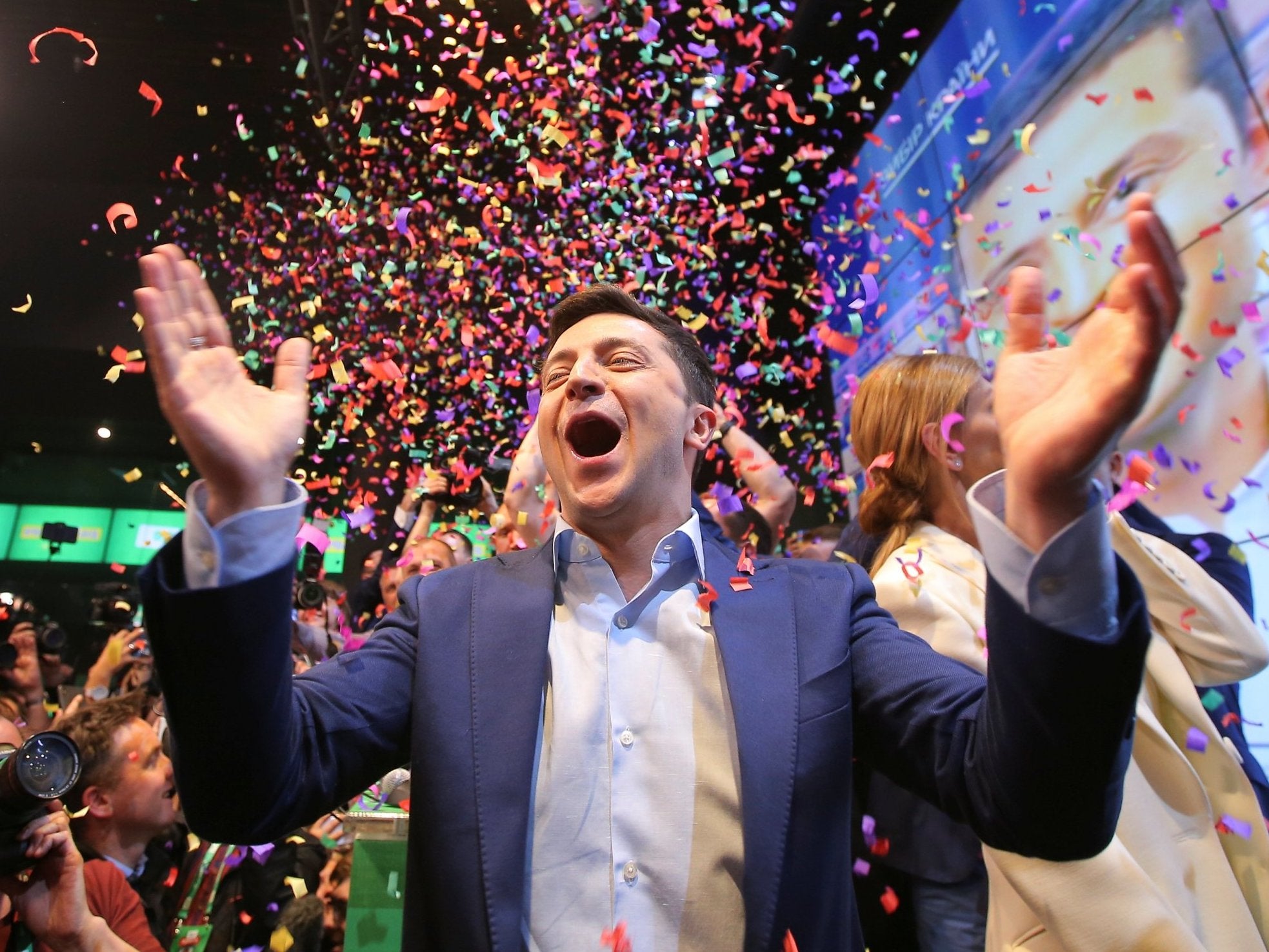 Ukrainian presidential candidate Volodymyr Zelenskiy reacts following the announcement of the first exit poll