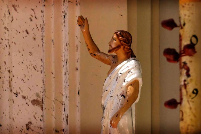 Blood stains the walls of St Sebastian's Church after a blast in Negombo, north of Colombo