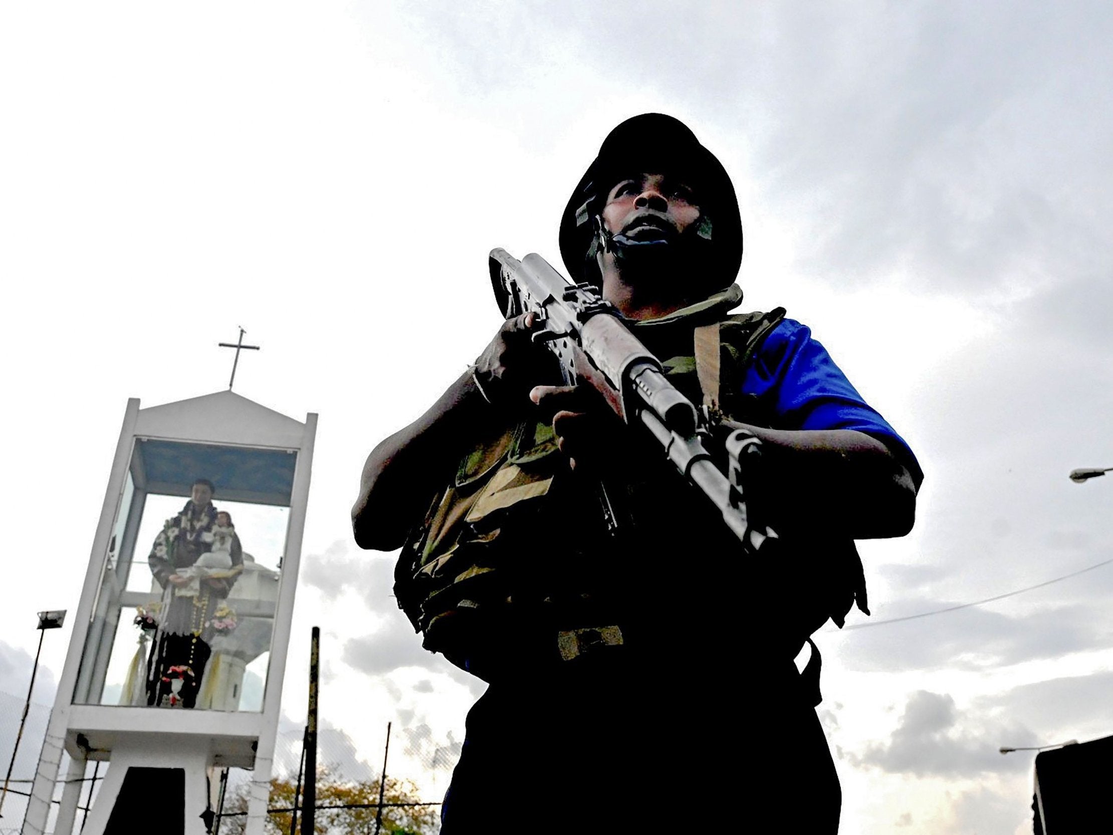 A Sri Lankan soldier stands guard after police tried to defuse a bomb near St Anthony’s Shrine in Colombo on Monday (AFP/Getty)