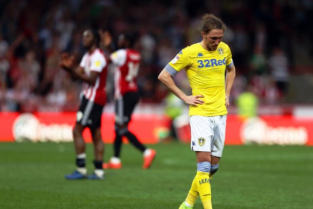 A dejected Luke Ayling looks on after defeat at Griffin Park
