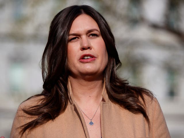 White House press secretary Sarah Sanders talks with reporters outside the White House in Washington on 4 April 2019