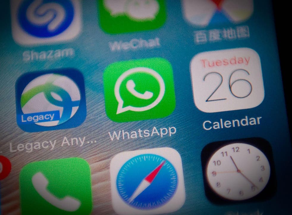 This file photo illustration taken on September 26, 2017 shows the Whatsapp application logo (C) on a smartphone screen in Beijing