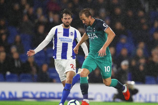 Harry Kane of Tottenham Hotspur battles for the ball with Davy Propper of Brighton