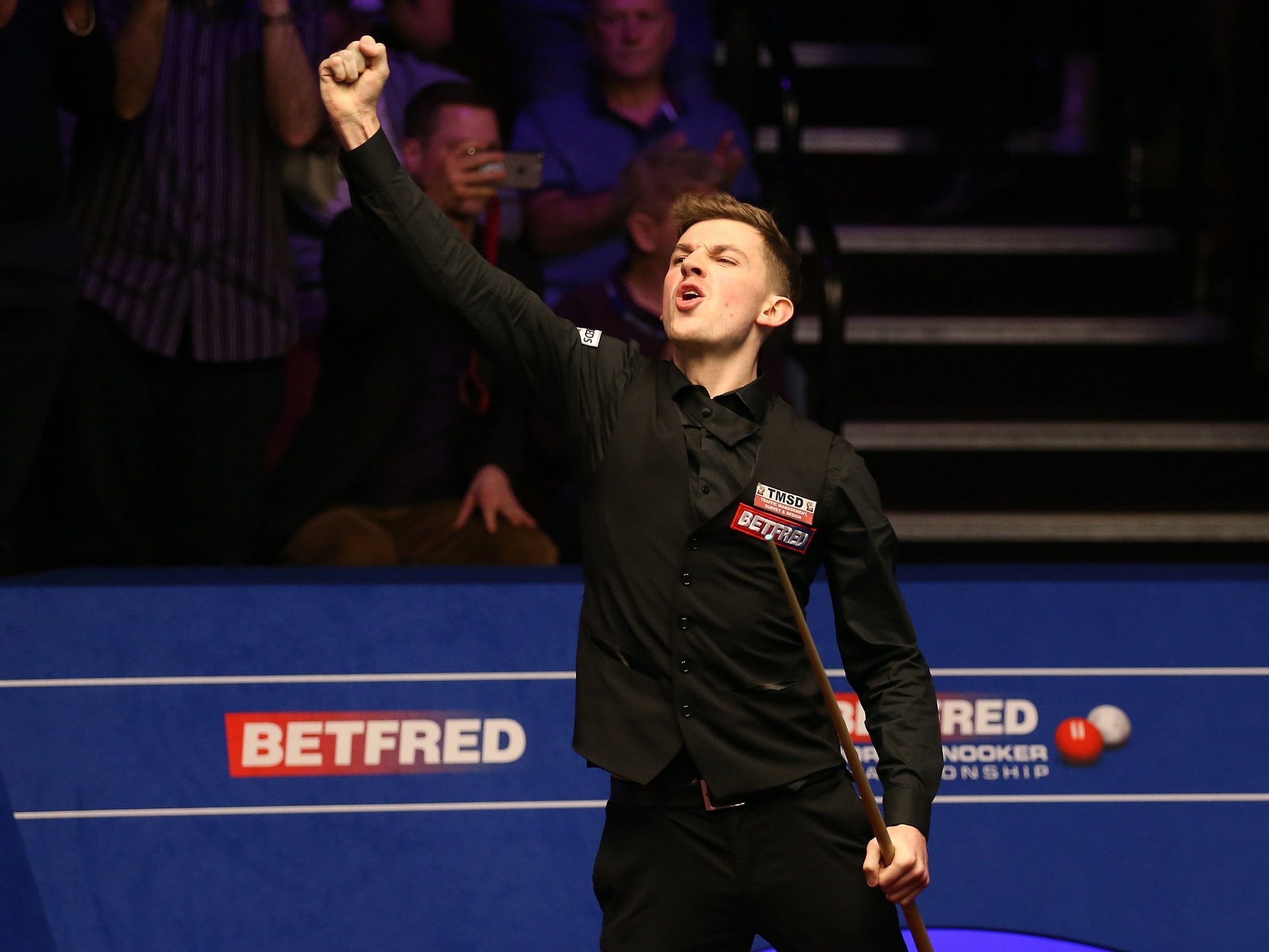 James Cahill celebrates his victory over O'Sullivan at the World Snooker Championship