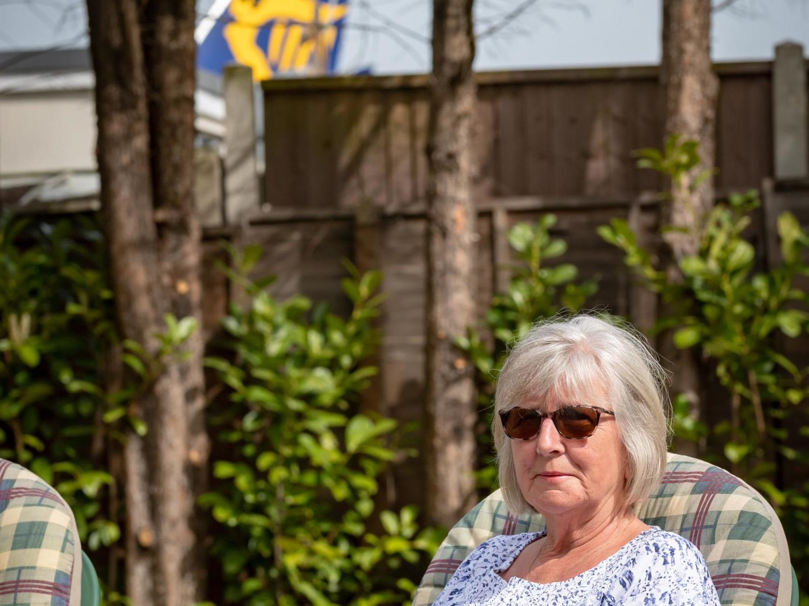 Janet Marchant, 67, in her garden which backs on to Southend Airport in Essex