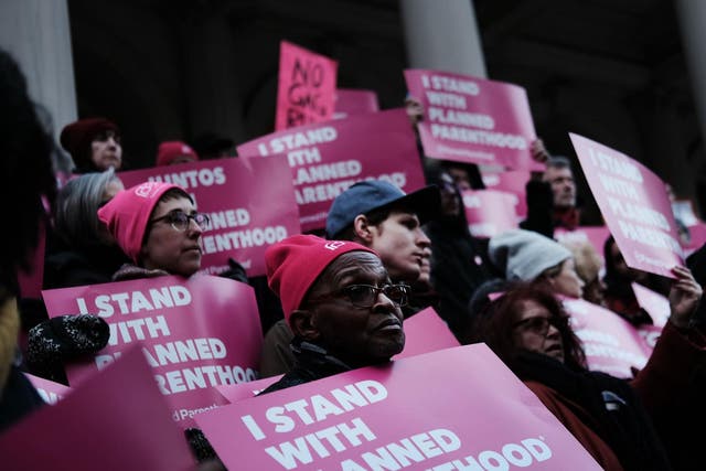 Pro-choice activists, politicians and others associated with Planned Parenthood gather against the Trump administration's title X rule change in February in New York City