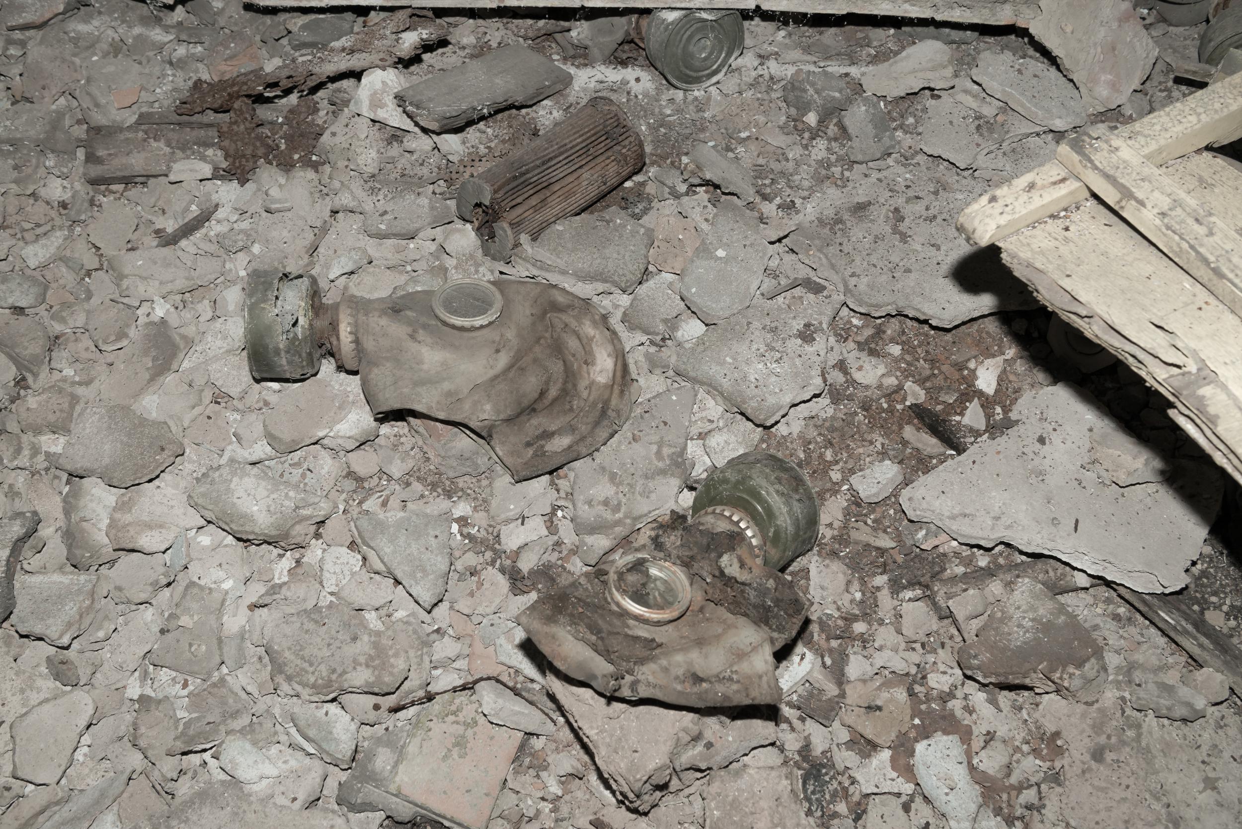 Gas masks litter the floor of one factory