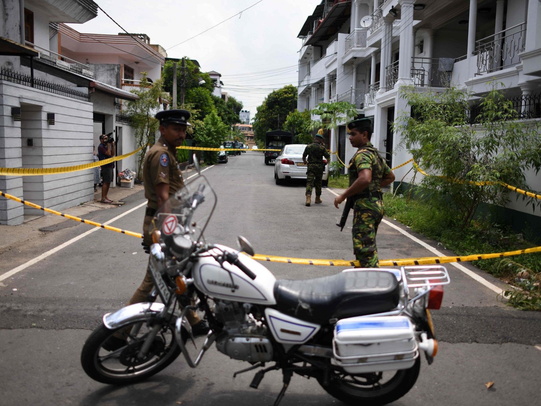Sri Lankan security personnel stand guard around the house of one of the suspected suicide bombers in Colombo (AFP/Getty)
