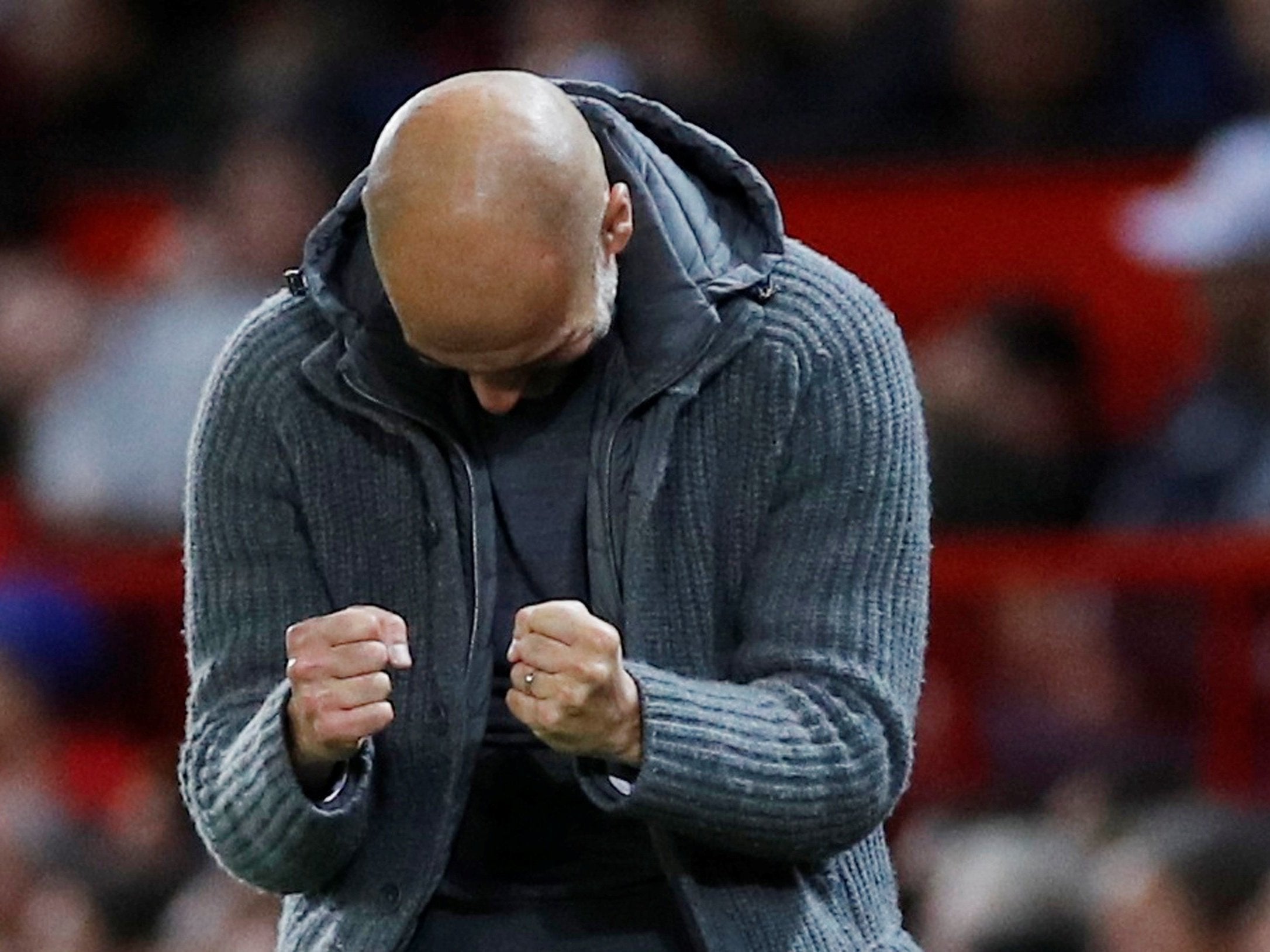 Pep Guardiola celebrates at the full-time whistle