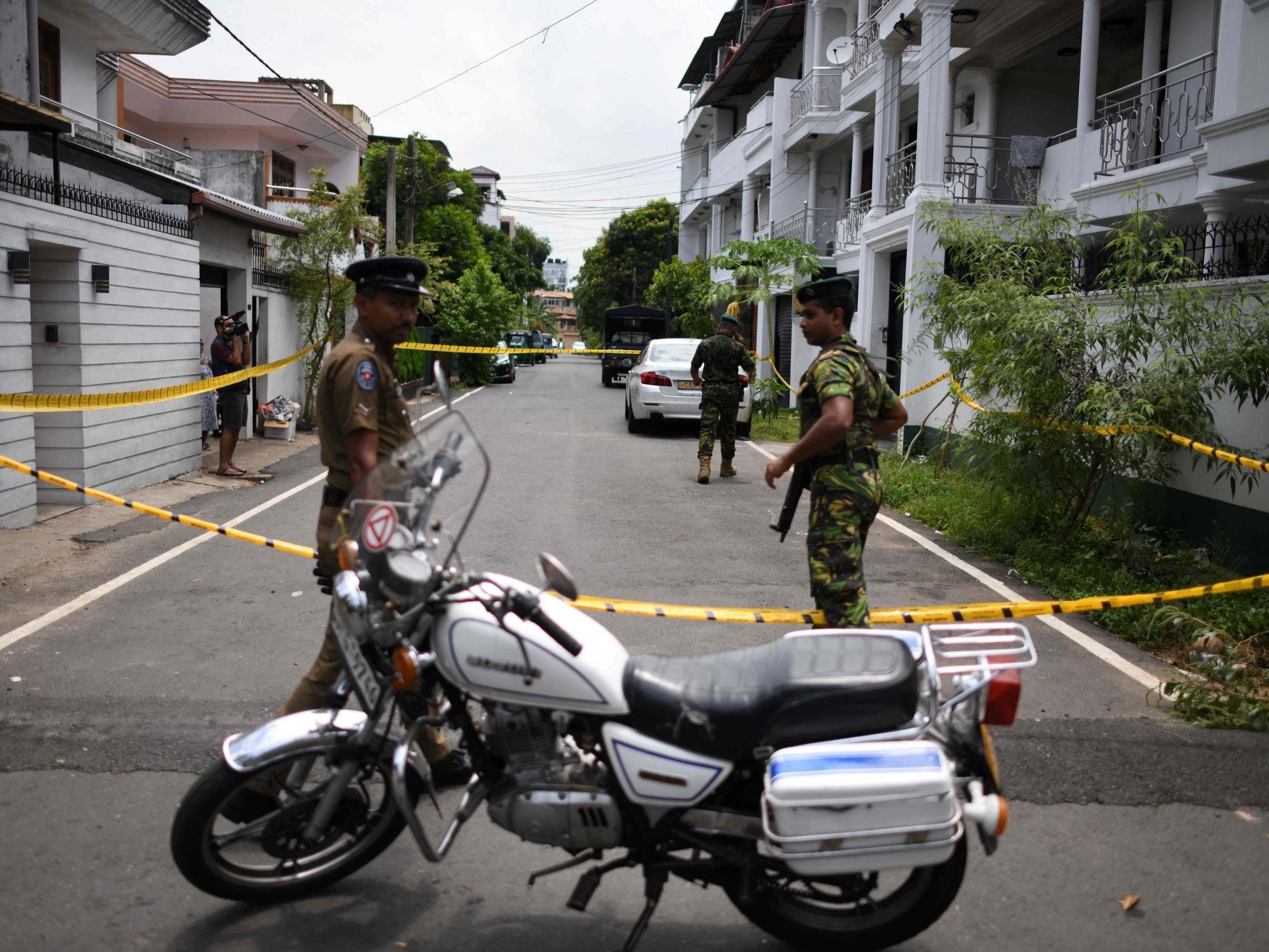 Sri Lankan security personnel guard house of one of the suspected suicide bombers in Colombo, April 23