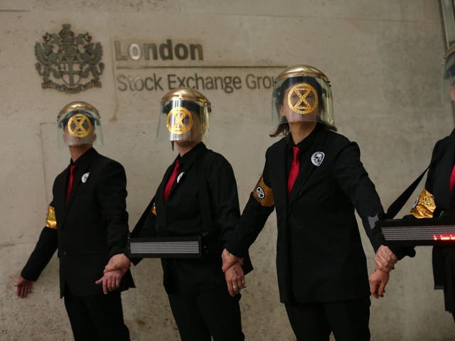 Extinction Rebellion protesters glued themselves to the entrances of the London Stock Exchange