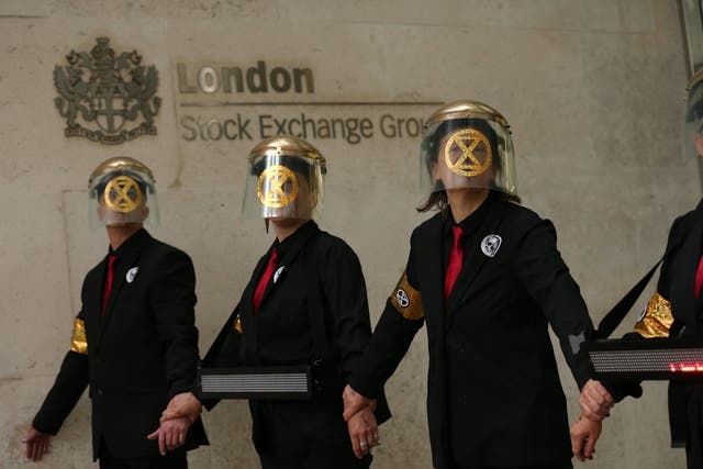 Extinction Rebellion protesters glued themselves to the entrances of the London Stock Exchange