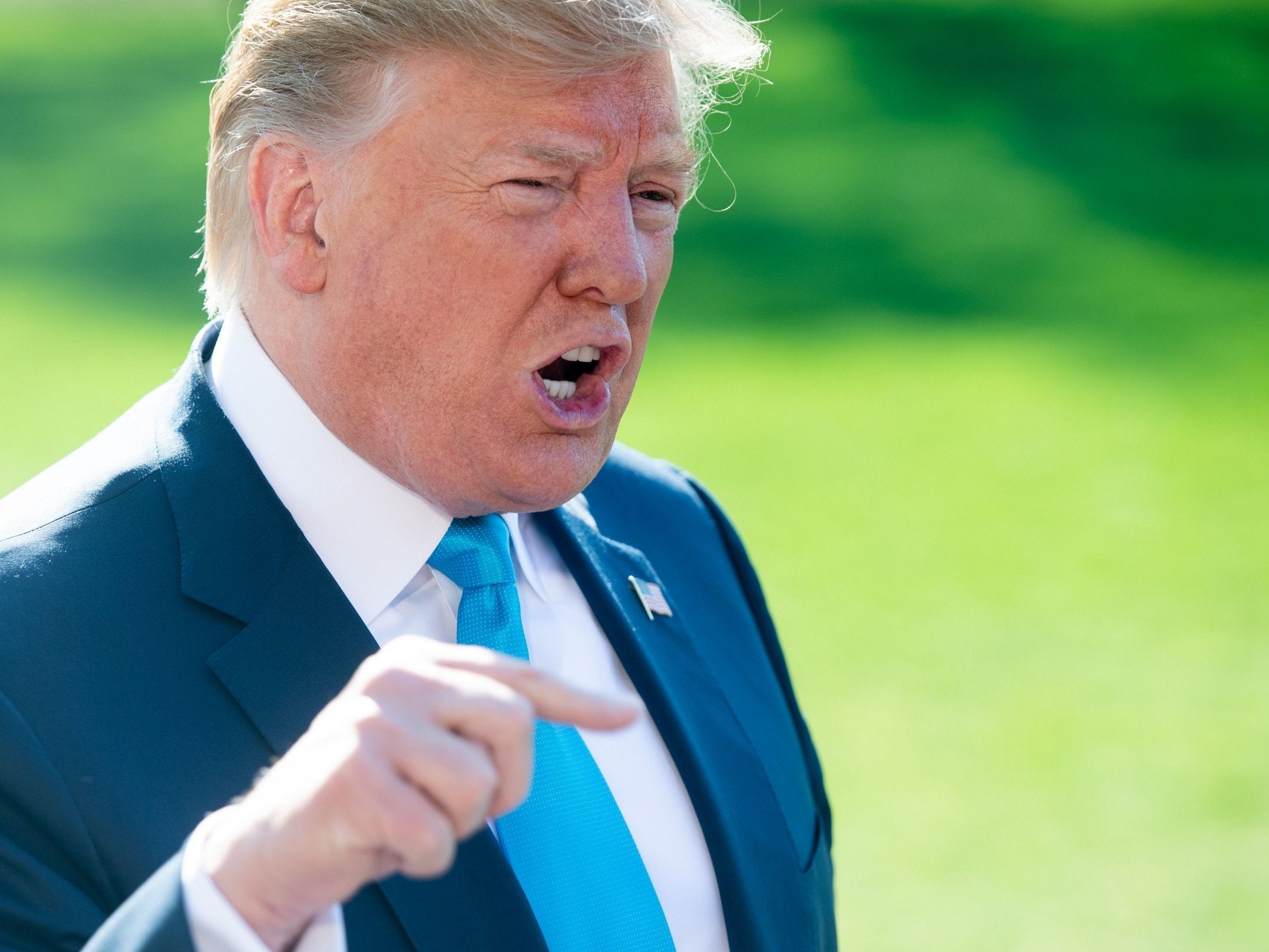Donald Trump speaks to the press prior to departing on Marine One from the South Lawn of the White House