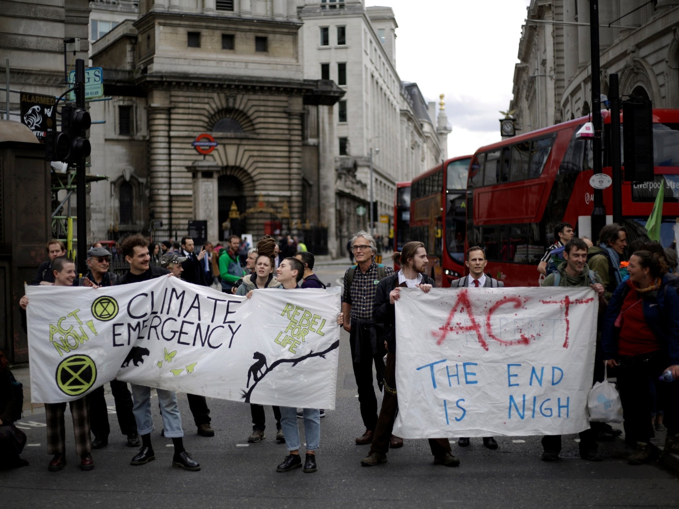 Climate change activists block the road near the Bank of England in the City of London on the final day of the Extinction Rebellion protests
