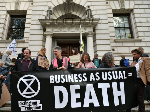 Extinction Rebellion protesters outside the Treasury Office in London