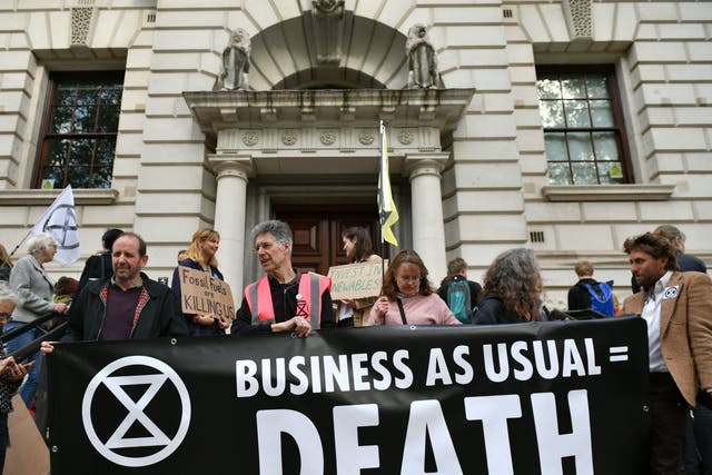 Extinction Rebellion protesters outside the Treasury Office in London