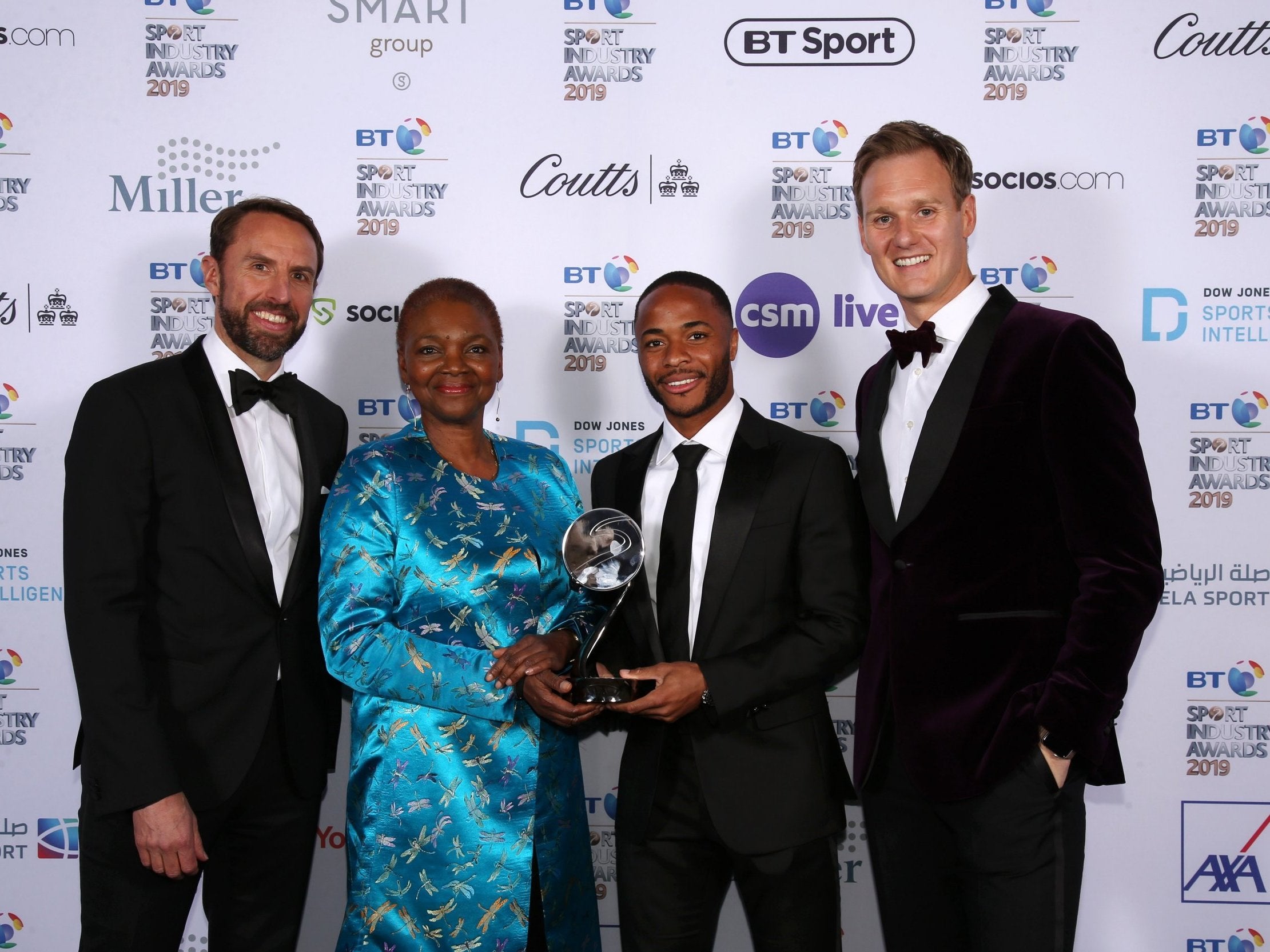 England manager Gareth Southgate, Baroness Amos and Dan Walker pose with Raheem Sterling