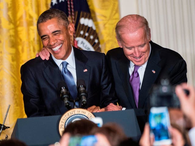 Then-US vice president Joe Biden jokes with Barack Obama in 2015