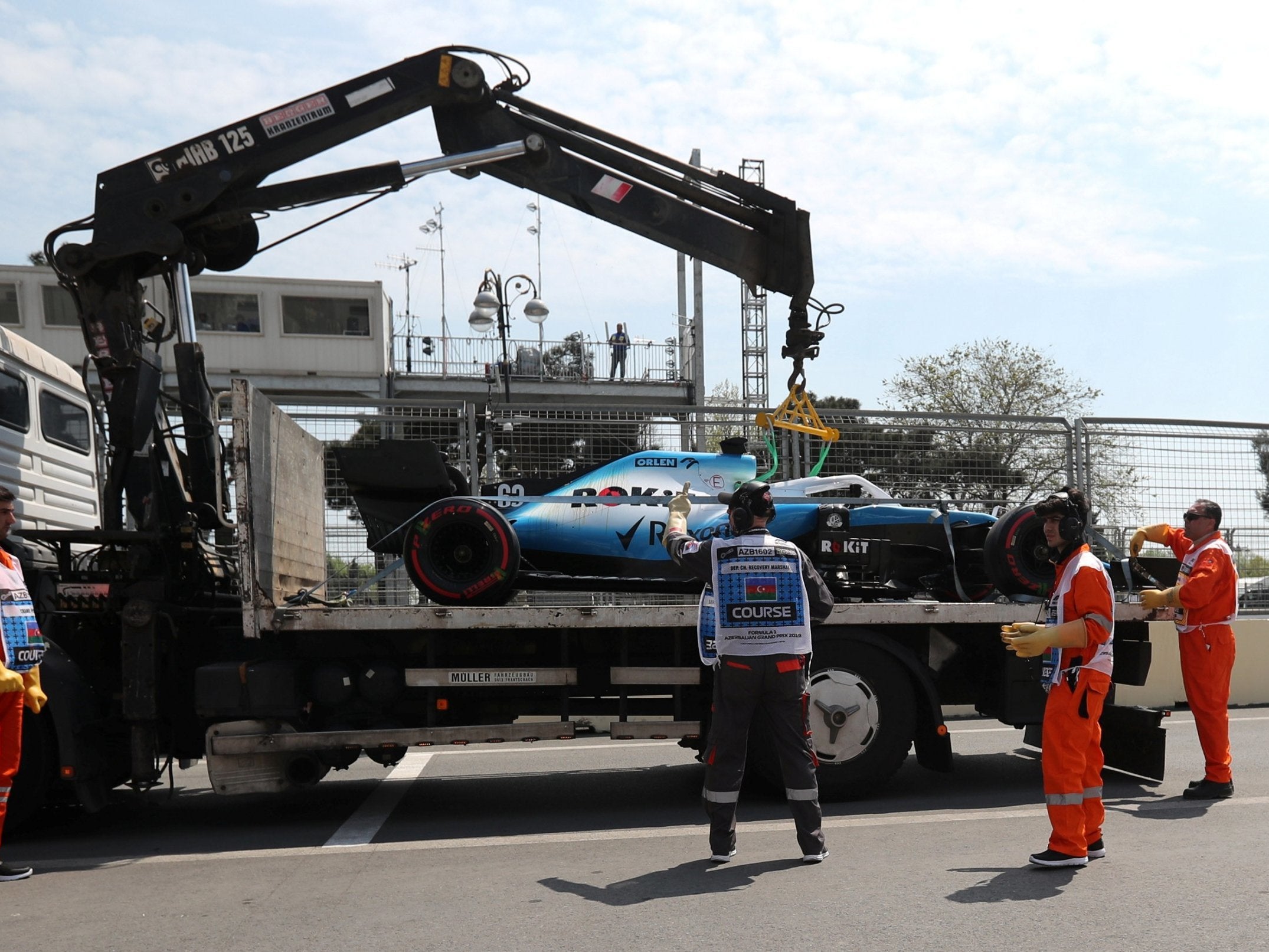 Russell's car was stranded after the lorry carrying it hit a bridge