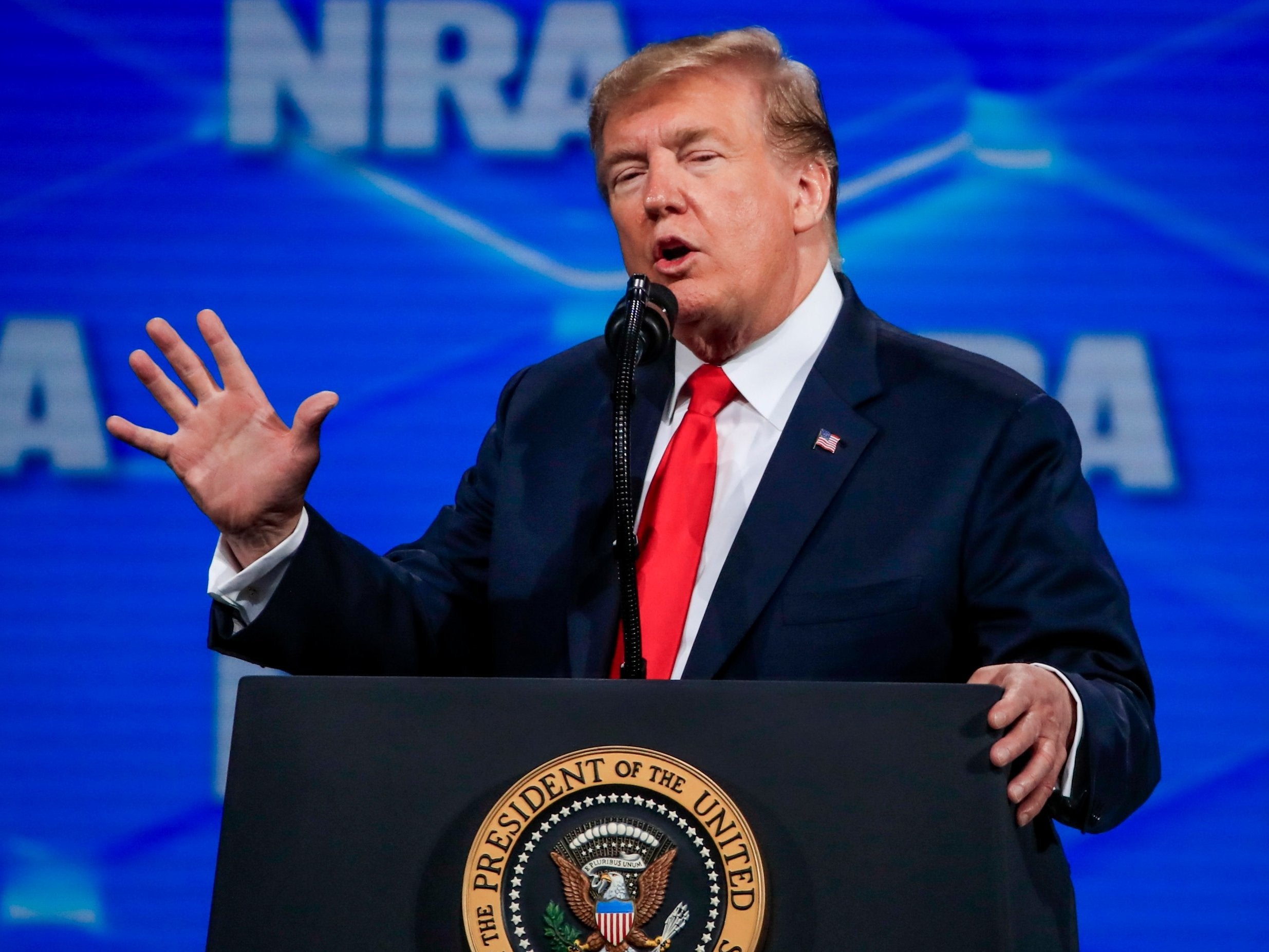 Trump re-enacts France terror attack with shooting gesture as he tells NRA convention he will pull US out of UN Arms Trade Treaty