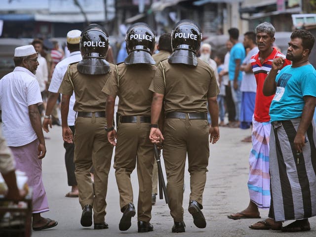 Sri Lankan police patrol Muslim neighborhood before Friday prayers in capital Colombo