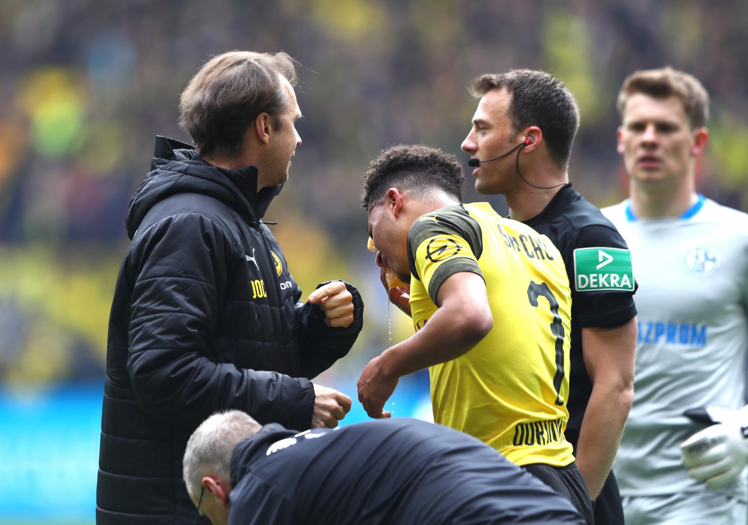Jadon Sancho was hit by a lighter thrown from the Schalke section