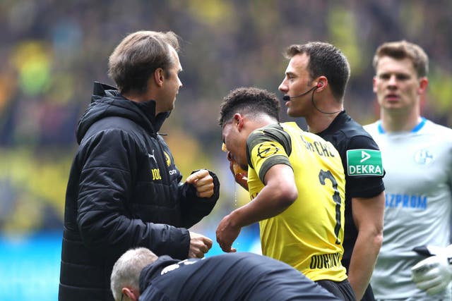 Jadon Sancho was hit by a lighter thrown from the Schalke section