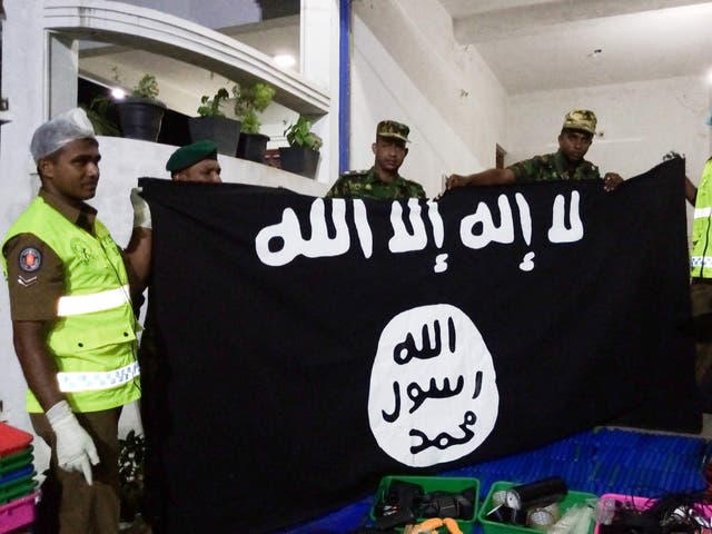 An Isis flag is discovered in a raid on a home in the town of Kalmunai