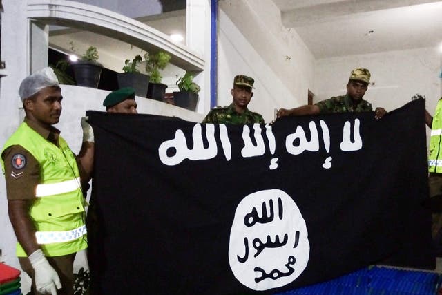 An Isis flag is discovered in a raid on a home in the town of Kalmunai