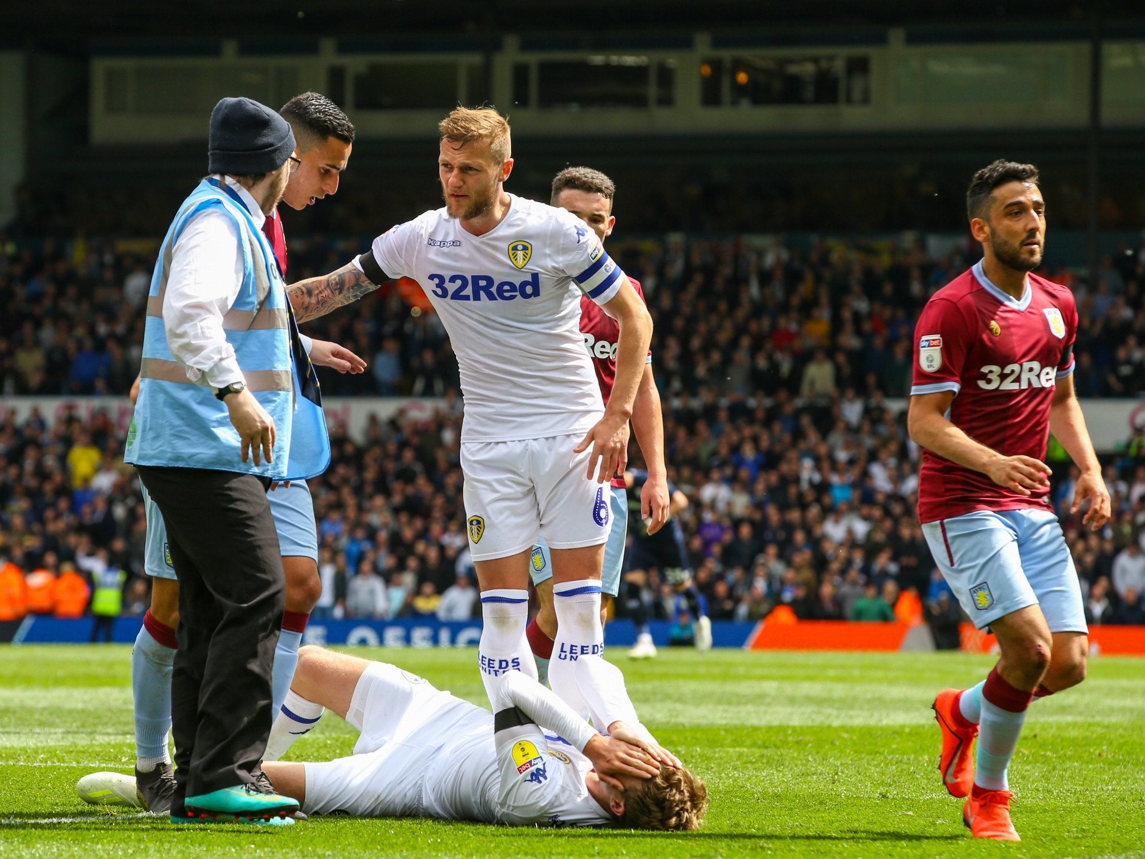 Patrick Bamford holds his head after Anwar El Ghazi's elbow