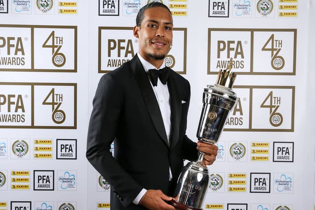 Virgil van Dijk poses with the PFA Player of the Year trophy