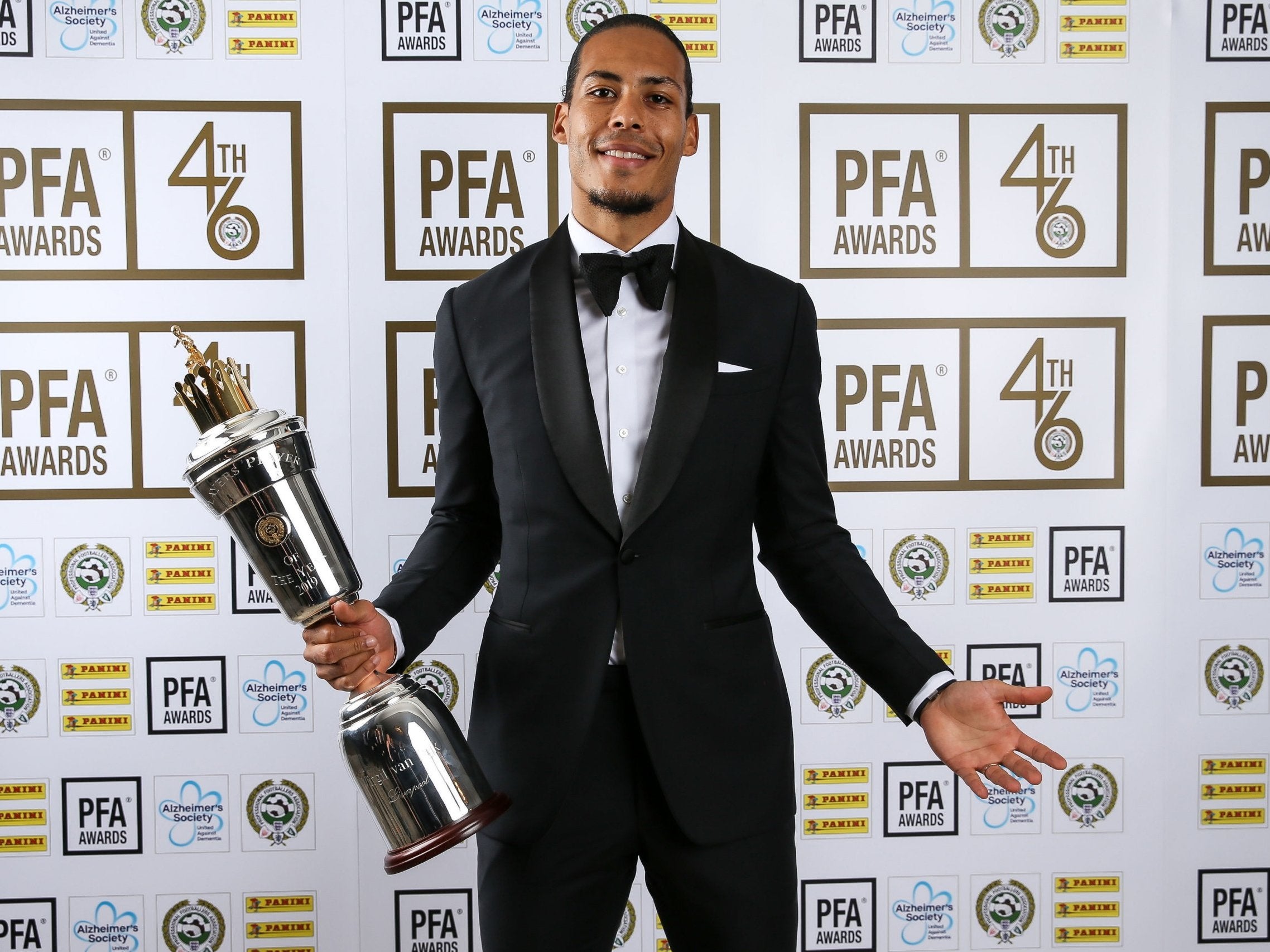 Virgil van Dijk celebrates with the main gong at the PFA awards