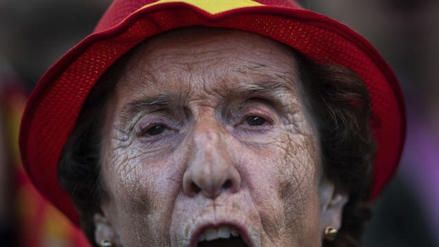 A supporter of Spanish far-right Vox party chants "long live Spain" in a closing event for the election campaign on April 26