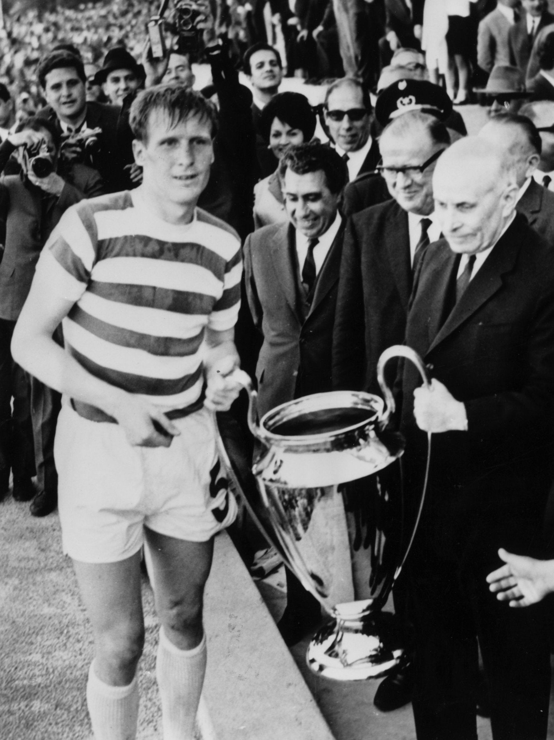 Billy McNeill collects the trophy following Celtic's European Cup triumph in 1967